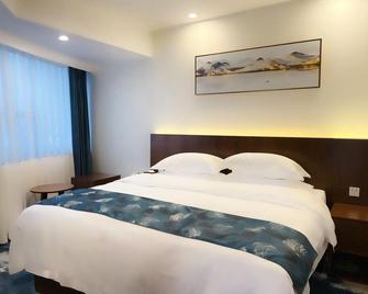 Mingyajingwei Hotel - Ťi-ning - Ložnice