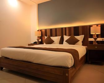 Lalys Residency - Rooms - Thrissur - Спальня