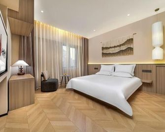 Dayuhaitang Homestay (Harbin Central Avenue, Harbin Songhuang River Highway Bridge Subway Station) - Harbin - Bedroom