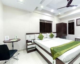 Treebo Trip Jai Ambe Maa - Kolkata - Bedroom