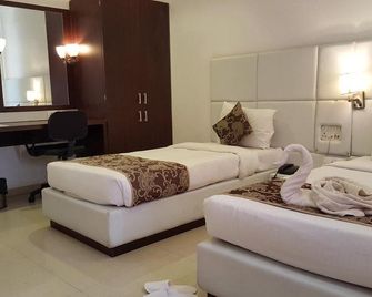 The Manor Hotel - אוראנגאבד - חדר שינה