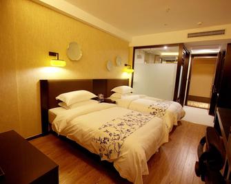 Crystal Pudi Hotel (Jingdezhen Taoyangli People's Square) - Jingdezhen - Habitación