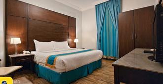 Lazourd Palace Hotel Apartments - Taif - Schlafzimmer