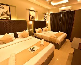 Dhanvantari Hotel - Mumbai - Bedroom