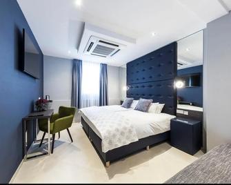 Hotel Tommasi - Mörfelden-Walldorf - Schlafzimmer