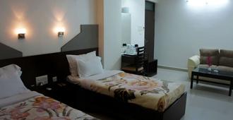 Orchid Business Luxury Hotel - Patna - Slaapkamer