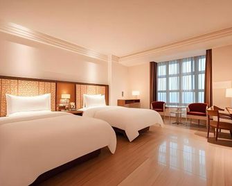 Jiajie Boutique Hotel (Lingao Cultural Park Fulo Plaza Branch) - Lingao - Habitación