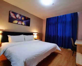 7 Days Inn Shangqiu Minzhu Road Walmart Branch - Shangqiu - Slaapkamer