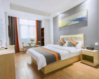 Xingyi Garden Hotel - Qianxinan - Bedroom