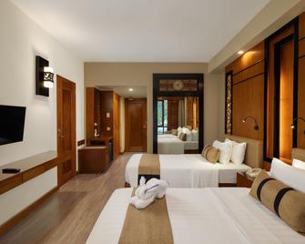 Nirwana Resort Hotel - Tanjung Pinang - Schlafzimmer