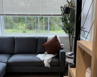 The Mockingbird Tiny Home - Perry - Living room