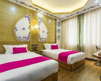 Home Of Heart Inn - Zhangjiajie - Bedroom