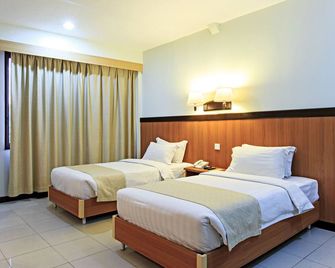 The Orchard Cebu Hotel & Suites powered by Cocotel - Mandaue City - Bedroom