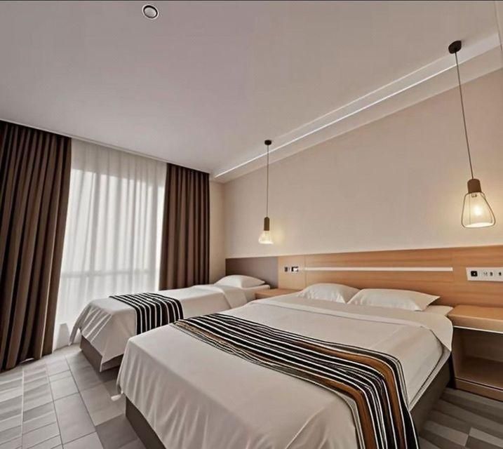 ثانك يو هوتل - تشينغداو - غرفة نوم