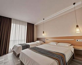 junyihotel - Qingdao - Bedroom