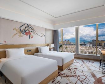 Yue Tian Xia Hotel - Honghe - Bedroom