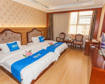 Jiule Boutique Hotel - Linyi - Schlafzimmer