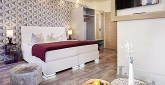 Auenwald Hotel Und Apartmenthaus - Lipsia - Camera da letto