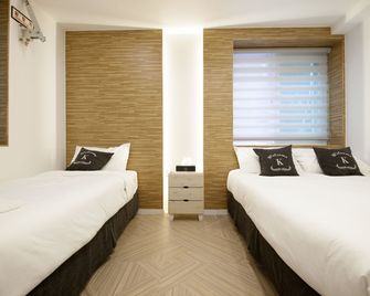 K-Guesthouse Seomyeon 1 - פוסן - חדר שינה