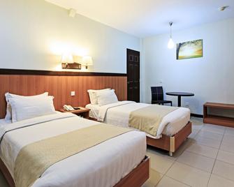 The Orchard Cebu Hotel & Suites powered by Cocotel - Mandaue City - Bedroom
