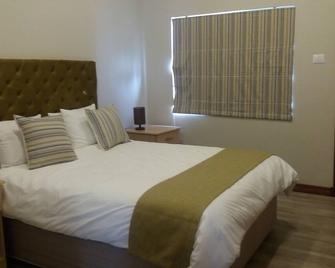 Staybridge Self Catering Apartments - Francistown - Bedroom