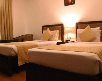 Hotel Clark Inn Kaushambi - Ghāziābād - Bedroom