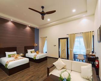 Mayang Sari Beach Resort - Lagoi - Schlafzimmer