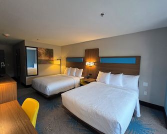 Days Inn & Suites by Wyndham Brandon Amphitheater - Brandon - Спальня