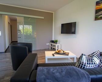 New comfort apartment with garden, terrace and barbecue. Feeling good included. - Merzig - Wohnzimmer