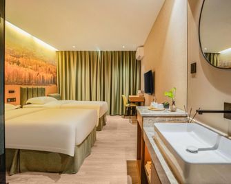 Qiankunrun Boutique Hotel (Meizhou Jiangbei) - Meizhou - Bedroom