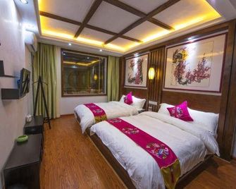 Phoenix Jiuqi Yayuan Inn (Gucheng Hongqiao Branch) - Xiangxi - Bedroom