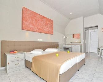 Sousouras Hotel - Chaniotis - Schlafzimmer