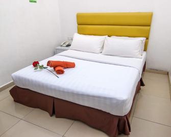 Rose Cottage Hotel Taman Impian Senai - Senai - Спальня