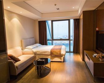 South Coast Vacation Hotel - تشينغداو - غرفة نوم