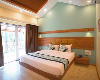 Aananda Wellness and Resorts - Dharmasthala - Bedroom