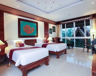 Kodchasri Thani Hotel Chiangmai - צ'אנג מאי - חדר שינה