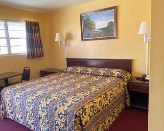 Deluxe Inn - Post - Habitación