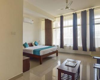 OYO 14144 Hotel Moriz Madikeri - Madikeri - Спальня