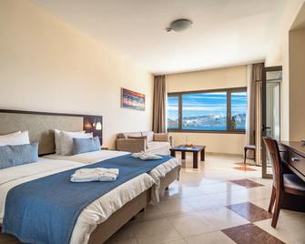 Porto Galini Seaside Resort & Spa - Nikiana - Спальня