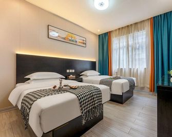 Yulong Hotel - Jiangmen - Slaapkamer