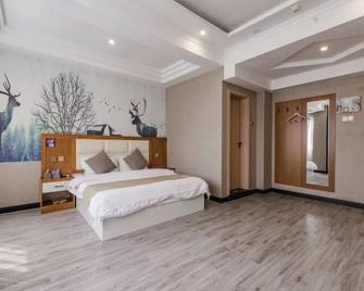 Shell Kaifeng City Lancao County Women and Children Hospital Hotel - Kaifeng - Schlafzimmer