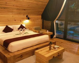 Welcomheritage Tarangi Ramganga Resort - Rāmnagar - Soveværelse