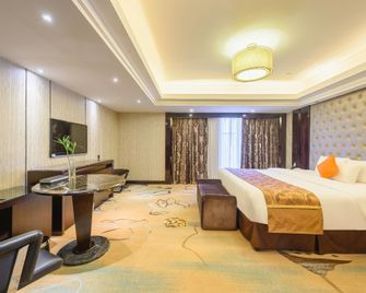 Shishi Wanjia International Hotel - تشيوانتشو - غرفة نوم