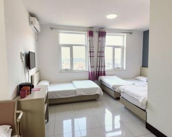 Tianjin Orange Apartment - Tianjín - Habitación