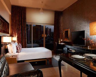 Ziqoo Hotel Apartments Dubai - Dubái - Habitación