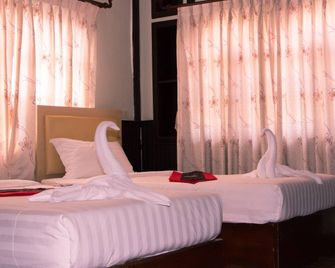 Central Vienna Hostel - Vientiane - Kamar Tidur