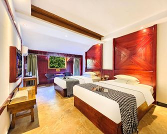 Wanjia Hostel Tujia Mingdi Inn - Xiangxi - Bedroom