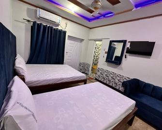 Spacious 6-bedroom house in charming Islamabad with AC, WiFi - Islamabad - Bedroom