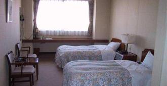 Midorigaoka Onsen Sauna Hotel - Obihiro - Bedroom