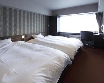 Business Hotel Takara - Kusatsu - Schlafzimmer
